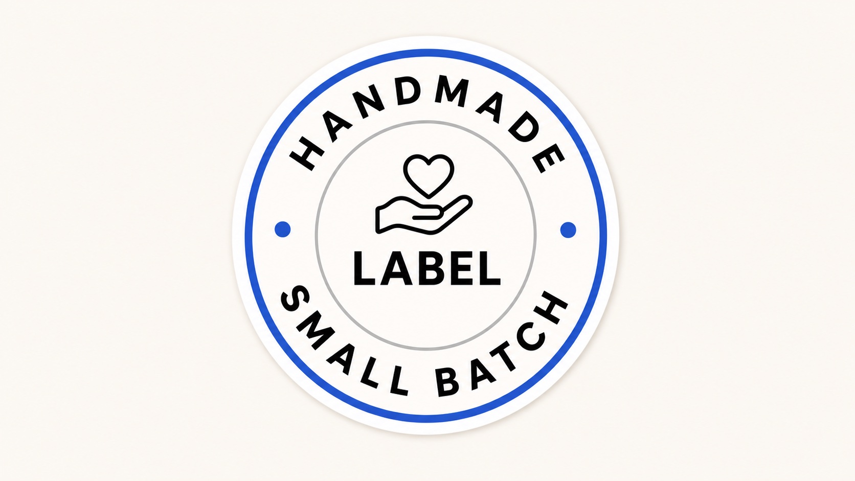 Round sticker label with handmade text around the top and small batch text around the bottom